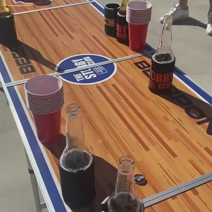 Beer pong table set up with cups for a game