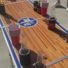 Beer pong table set up with cups for a game